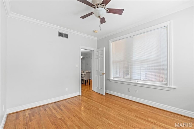 6318 Southwood Ave Unit 1W, Saint Louis, MO 63105 - spare room featuring ornamental molding, baseboards, wood finished floors, and ceiling fan