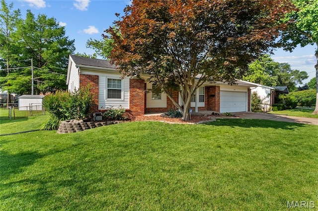 430 Coachway Ln, Hazelwood, MO 63042 - view of property hidden behind natural elements featuring brick siding, a garage, and driveway