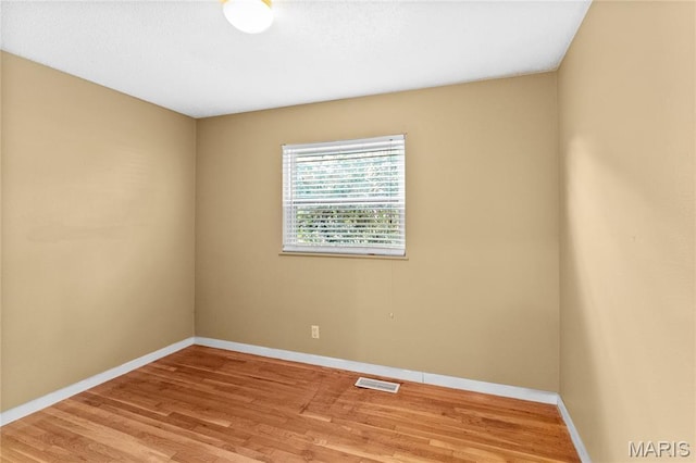 430 Coachway Ln, Hazelwood, MO 63042 - unfurnished room with wood finished floors and baseboards