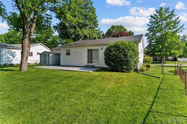 430 Coachway Ln, Hazelwood, MO 63042 - back of house featuring a storage shed and a patio
