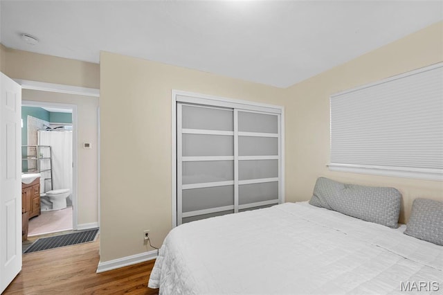 2604 Tamm Ave, Saint Louis, MO 63139 - bedroom featuring wood finished floors and a closet