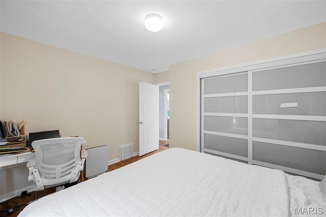 2604 Tamm Ave, Saint Louis, MO 63139 - bedroom with a desk and wood finished floors