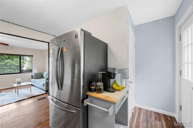 2604 Tamm Ave, Saint Louis, MO 63139 - kitchen with freestanding refrigerator, wood finished floors, and butcher block counters