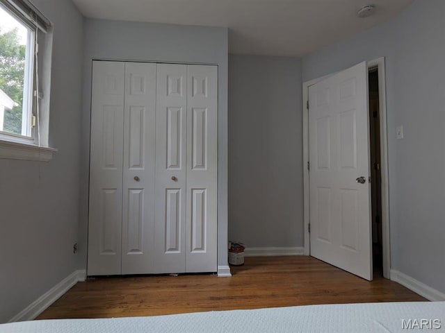 2604 Tamm Ave, Saint Louis, MO 63139 - unfurnished bedroom with wood finished floors and a closet