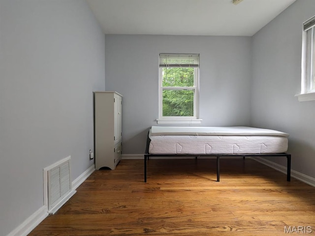 2604 Tamm Ave, Saint Louis, MO 63139 - bedroom with baseboards and wood finished floors
