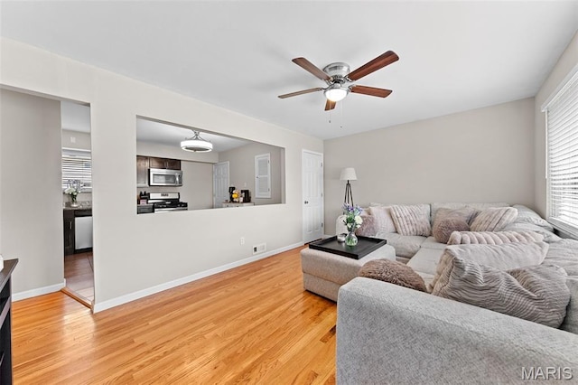 4620 Kramer Dr, Saint Louis, MO 63123 - living area with light wood-style floors and a ceiling fan