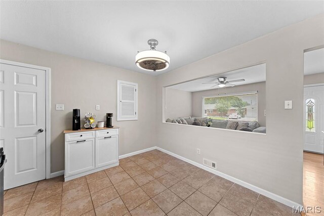 4620 Kramer Dr, Saint Louis, MO 63123 - unfurnished dining area with a ceiling fan and light tile patterned floors