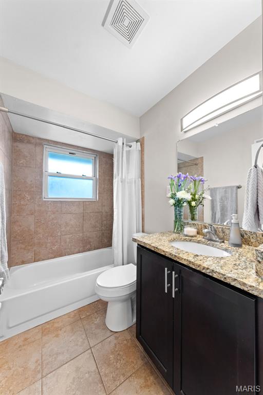 4620 Kramer Dr, Saint Louis, MO 63123 - full bathroom with vanity, shower / bathtub combination with curtain, and tile patterned flooring