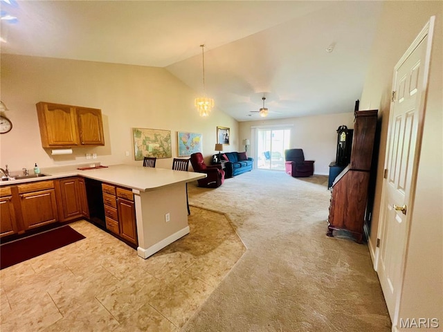 305 Hawk Nest Ct, Union, MO 63084 - kitchen featuring a peninsula, light colored carpet, light countertops, vaulted ceiling, and brown cabinets