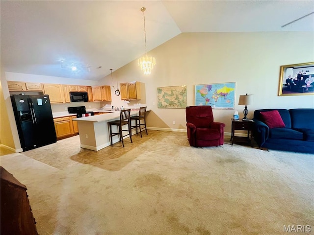 305 Hawk Nest Ct, Union, MO 63084 - kitchen featuring black appliances, light colored carpet, open floor plan, lofted ceiling, and light countertops