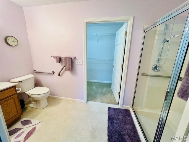 305 Hawk Nest Ct, Union, MO 63084 - bathroom with a shower stall, vanity, and a spacious closet