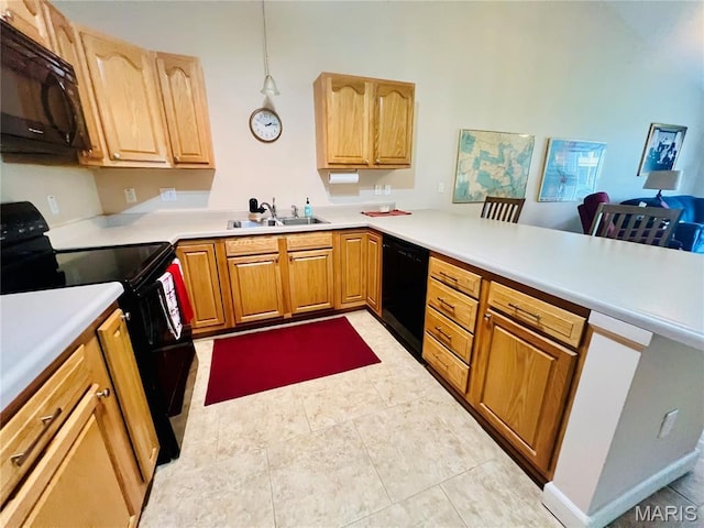 305 Hawk Nest Ct, Union, MO 63084 - kitchen with black appliances, a peninsula, light countertops, and a towering ceiling