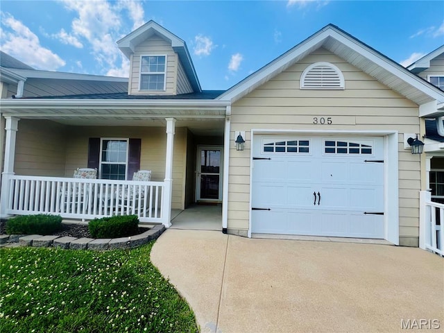 305 Hawk Nest Ct, Union, MO 63084 - view of front of property featuring a porch, driveway, and a garage
