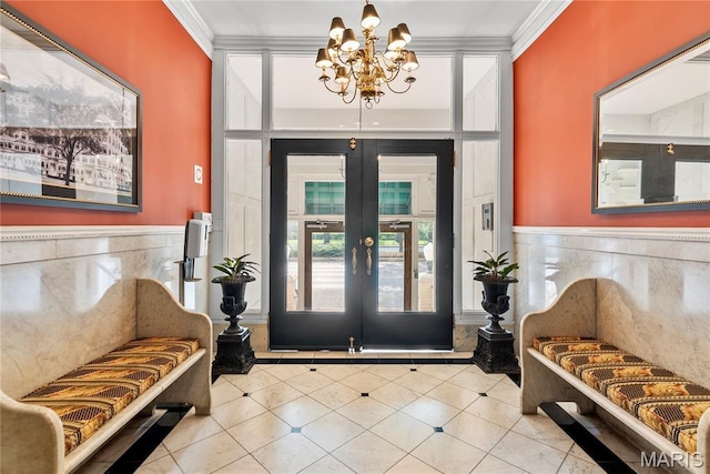 10 N Kingshighway Blvd Unit 2Cs, Saint Louis, MO 63108 - entrance foyer featuring a chandelier, ornamental molding, french doors, tile patterned flooring, and wainscoting