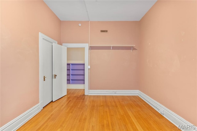 10 N Kingshighway Blvd Unit 2Cs, Saint Louis, MO 63108 - empty room featuring wood finished floors and baseboards