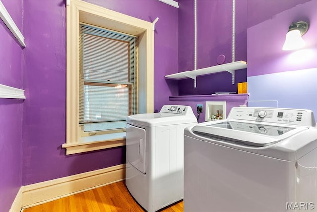 10 N Kingshighway Blvd Unit 2Cs, Saint Louis, MO 63108 - washroom featuring washer and clothes dryer and wood finished floors