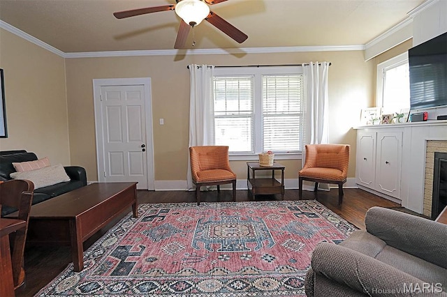 1425 Perryville Cpe, Girardeau, MO 63701 - living area featuring wood finished floors, ornamental molding, a ceiling fan, a fireplace, and baseboards