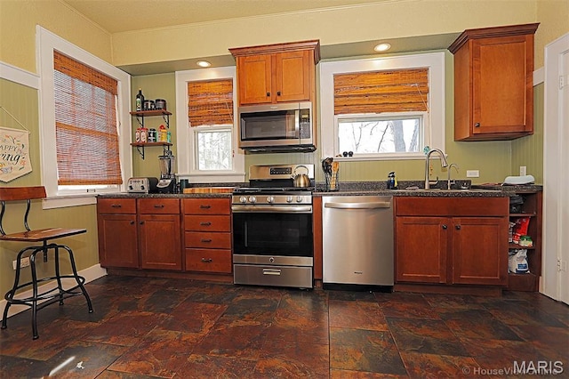 1425 Perryville Cpe, Girardeau, MO 63701 - kitchen featuring stainless steel appliances, a sink, open shelves, dark stone countertops, and brown cabinets