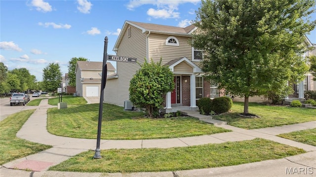3101 Keelboat Xing, Saint Charles, MO 63301 - view of front facade featuring a front yard and brick siding