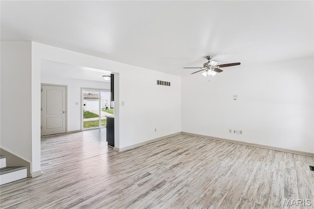 3101 Keelboat Xing, Saint Charles, MO 63301 - unfurnished room with wood finished floors, a ceiling fan, and stairway