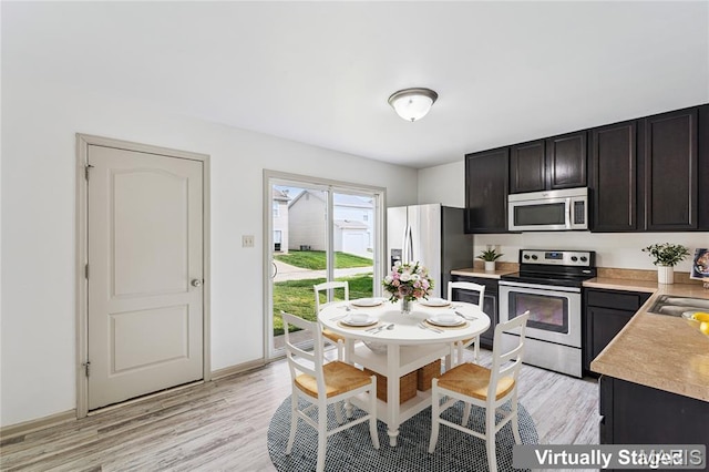 3101 Keelboat Xing, Saint Charles, MO 63301 - kitchen with appliances with stainless steel finishes, light countertops, and light wood-style flooring