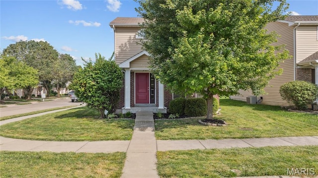 3101 Keelboat Xing, Saint Charles, MO 63301 - obstructed view of property with a front lawn and brick siding