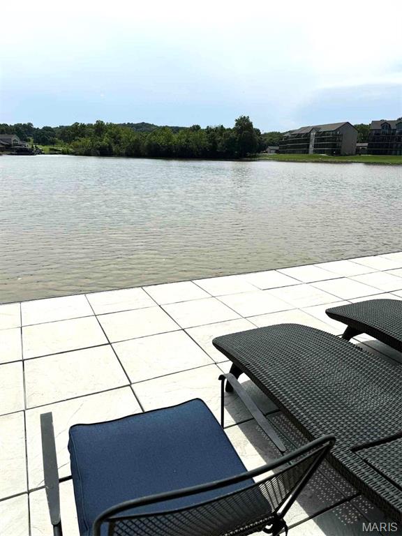 63 Rock Dove Ln, Camdenton, MO 65020 - view of patio / terrace with a water view