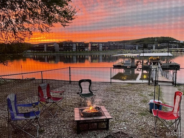 63 Rock Dove Ln, Camdenton, MO 65020 - water view with a fire pit and a dock