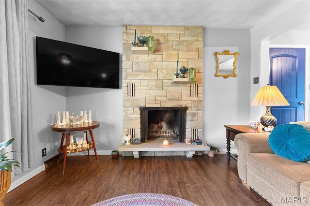 611 Park St, Farmington, MO 63640 - living area featuring wood finished floors and a stone fireplace