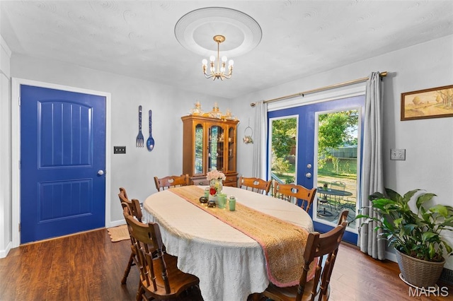 611 Park St, Farmington, MO 63640 - dining area featuring dark wood-style floors, a chandelier, and french doors
