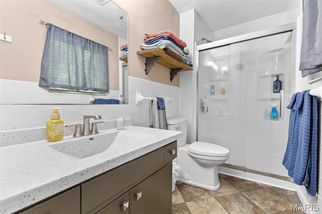 611 Park St, Farmington, MO 63640 - full bathroom with a shower stall, vanity, wainscoting, and tile walls