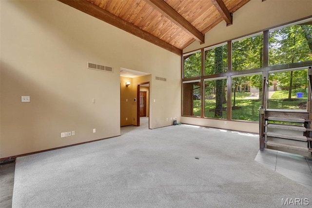 1509 Redbriar Dr, High Ridge, MO 63049 - empty room featuring a wooden ceiling with exposed beams, plenty of natural light, carpet, and high vaulted ceiling