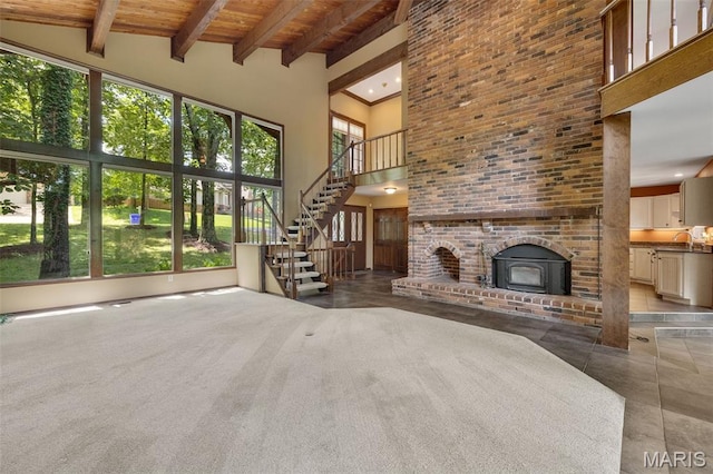 1509 Redbriar Dr, High Ridge, MO 63049 - unfurnished living room featuring a high ceiling, a wooden ceiling with exposed beams, stairway, and recessed lighting