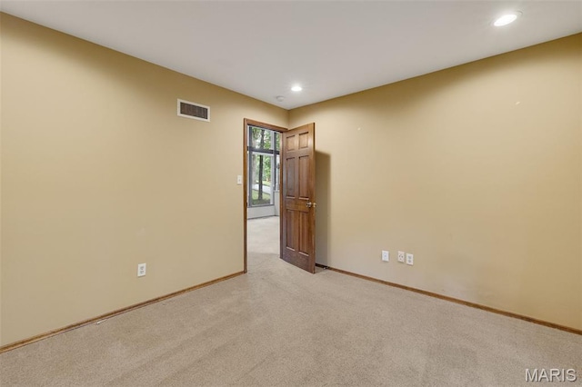 1509 Redbriar Dr, High Ridge, MO 63049 - spare room with light colored carpet and recessed lighting