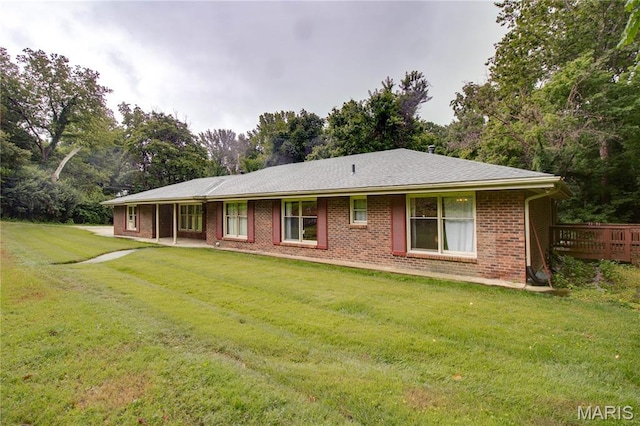 10000 Wondell Woods Dr, Belleville, IL 62223 - back of property with a lawn, brick siding, and view of wooded area