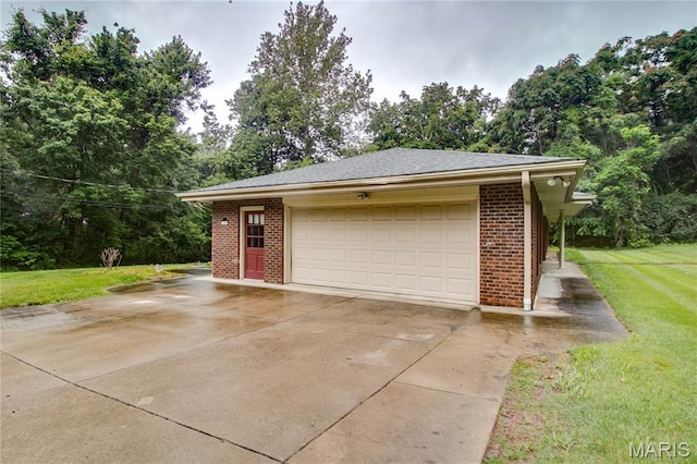 10000 Wondell Woods Dr, Belleville, IL 62223 - garage with concrete driveway and view of scattered trees