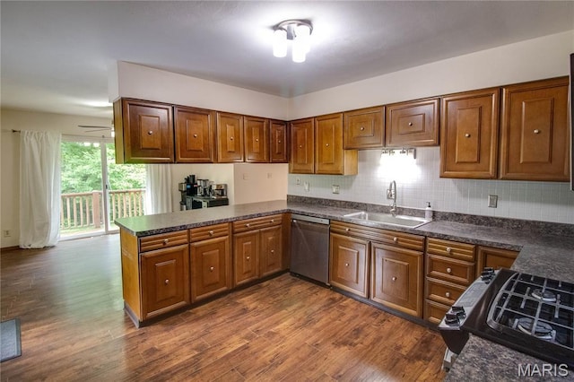 10000 Wondell Woods Dr, Belleville, IL 62223 - kitchen with stainless steel dishwasher, dark countertops, black range with gas cooktop, and dark wood-type flooring