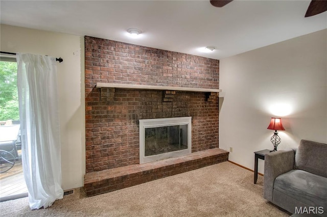 10000 Wondell Woods Dr, Belleville, IL 62223 - living area with carpet floors, a ceiling fan, and a fireplace