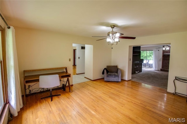 10000 Wondell Woods Dr, Belleville, IL 62223 - living area featuring light wood finished floors and ceiling fan