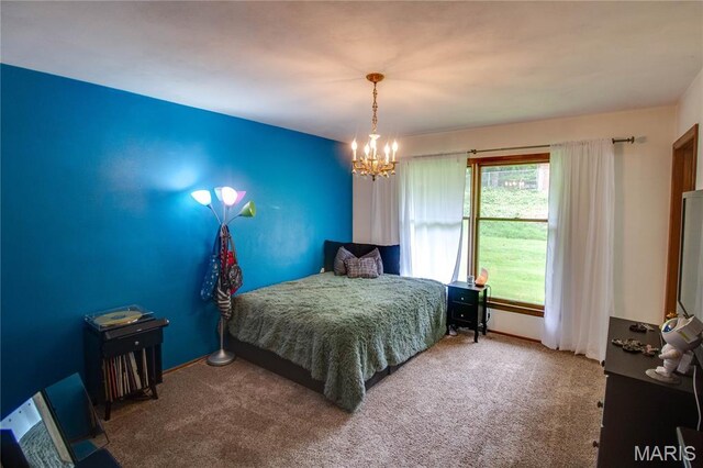 10000 Wondell Woods Dr, Belleville, IL 62223 - carpeted bedroom featuring a chandelier and baseboards