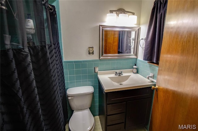 10000 Wondell Woods Dr, Belleville, IL 62223 - bathroom with vanity, a wainscoted wall, tile walls, and curtained shower