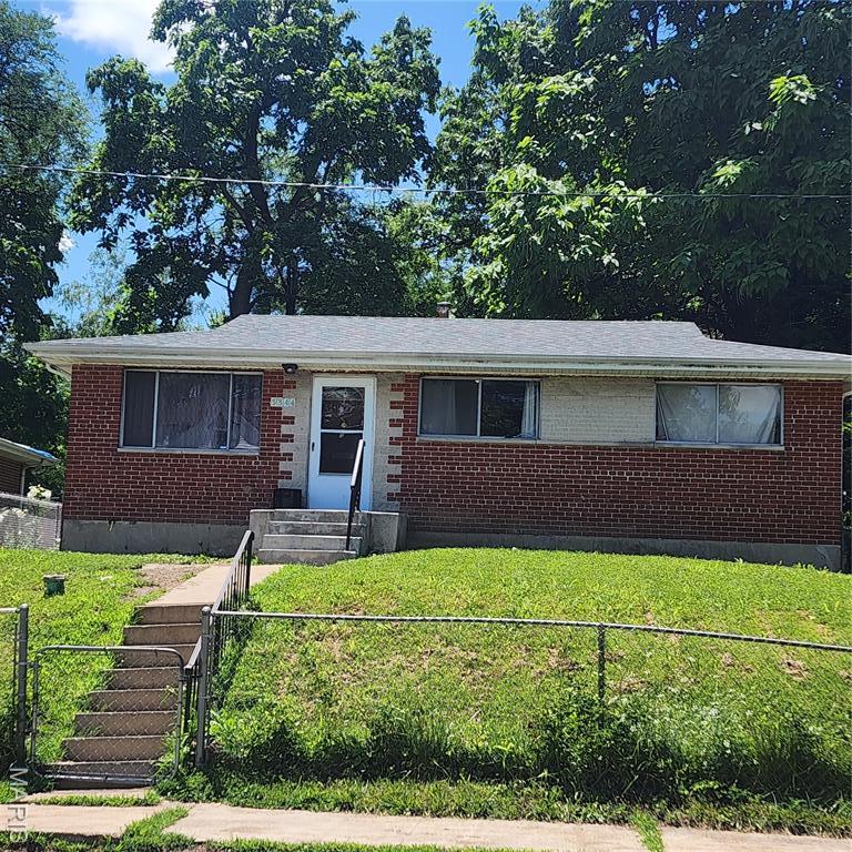 5344 Northland Ave, Saint Louis, MO 63112 - view of front of property featuring brick siding, a gate, and entry steps