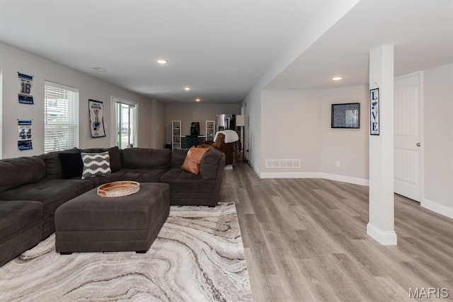 509 Spruce Hollow Ct, Wentzville, MO 63385 - living area featuring light wood-style flooring and recessed lighting