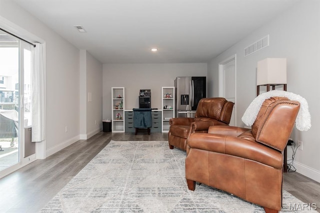 509 Spruce Hollow Ct, Wentzville, MO 63385 - living area with wood finished floors, recessed lighting, and a desk