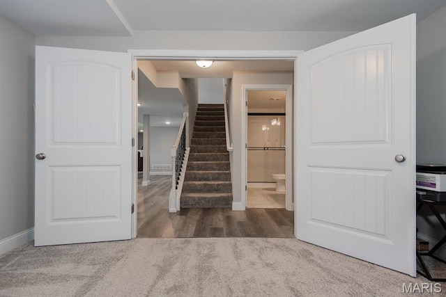509 Spruce Hollow Ct, Wentzville, MO 63385 - stairway with baseboards and wood finished floors