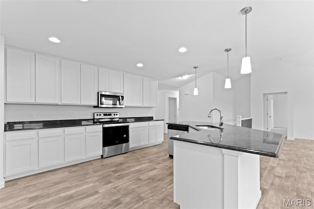 104 Tick Rd, Silex, MO 63377 - kitchen featuring appliances with stainless steel finishes, light wood-style flooring, white cabinetry, recessed lighting, and hanging light fixtures