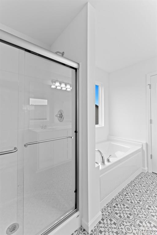 104 Tick Rd, Silex, MO 63377 - full bathroom featuring a shower stall and a bath