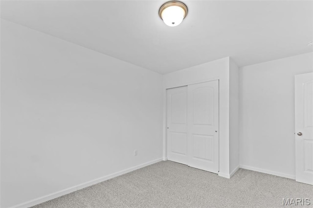 104 Tick Rd, Silex, MO 63377 - unfurnished bedroom featuring light carpet and a closet