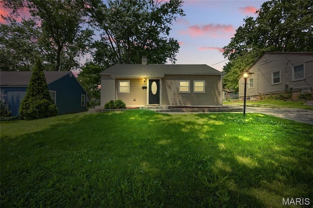 7825 Delmont St, Saint Louis, MO 63123 - ranch-style home with a front lawn and a chimney