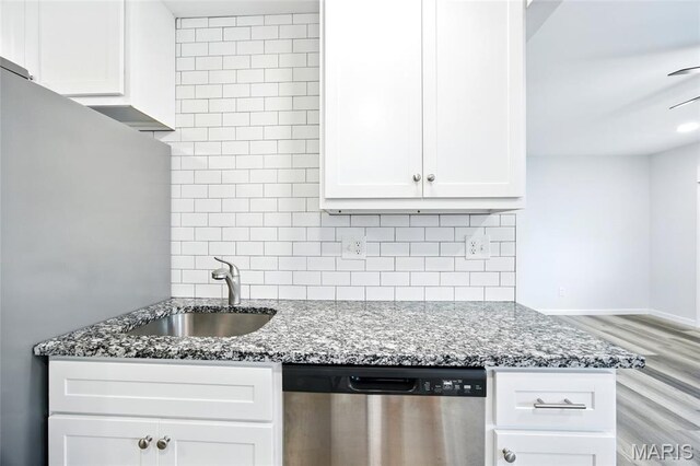 7825 Delmont St, Saint Louis, MO 63123 - kitchen with dishwasher, a sink, tasteful backsplash, and stone counters